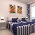 Tahití Playa Suites in Santa Susanna, guest room with twin beds and sea-view balcony