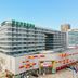 Iris Orchard All Suites Hotel (Tangshan Convention Center) in Tangshan, modern hotel exterior with colorful facade