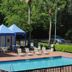 Days Inn by Wyndham Jacksonville Airport pool with cabanas and lounge chairs in Jacksonville