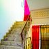 Hotel Ashoka Palace Near Igi Airport, New Delhi staircase with ornate railing and red curtains