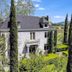 Chateau de Vie in Calistoga, white hotel exterior with manicured gardens and mountain views