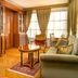 Judita Palace Heritage Hotel in Split, elegant suite with sofa, round table and tall windows