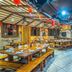 Hakka Park International Hotel, Meizhou: spacious restaurant with long wooden tables and red lantern decor