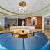 Holiday Inn Express & Suites Lakeland South lobby with modern seating and chandelier in Lakeland