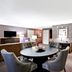 DoubleTree by Hilton Downtown Wilmington - Legal District lounge suite with seating area and TV