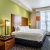 Fairfield Inn & Suites by Marriott Alamogordo guest room with king bed, desk, TV and window
