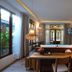Railay Phutawan Resort in Ao Nang with a wooden bedroom, bathtub, hanging lamps, and balcony doors