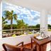 Playacartaya balcony dining area with palm tree views in Cartaya