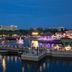 Hilton Orlando Lake Buena Vista - Disney Springs Area waterfront night view with lit fountains and marina