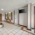 Econo Lodge Charlotte Airport Area lobby in Charlotte with seating, tiled floor, and wall-mounted TV