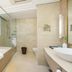 Urumqi Southern Airlines Pearl International Hotel bathroom with bathtub, glass shower and city view in Ürümqi