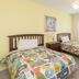 Villas at Seven Dwarfs Lane Resort in Kissimmee bedroom with two twin beds and window light