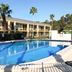 Econo Lodge Ormond Beach North - Daytona outdoor pool with palm trees in Ormond Beach