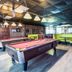 Econo Lodge Ormond Beach North - Daytona game room with pool tables and booth seating in Ormond Beach