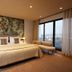 Montebelo Viseu Congress Hotel, Viseu: guest room with king bed, floral wall art and city view