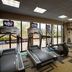 Courtyard by Marriott Fayetteville fitness room with treadmills, exercise bike and dumbbells