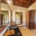 Amertha Bali Villas in Gerokgak: villa bathroom with wooden doors, mirror, sink, and open shelving