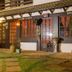 Maratea Mare in Florianopolis, exterior of bistro entrance with lit windows and garden walkway