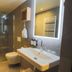 Hotel Abdij Dokkum bathroom with walk-in shower, wall-hung toilet, and illuminated mirror in Dokkum