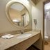 Red Roof Inn Asheville - Biltmore West bathroom with granite vanity, mirror and shower-tub combo