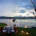 Habarana Village by Cinnamon in Habarana: lakeside dining setup at sunset with water and hills