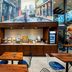 Breakfast area at Fairfield Inn & Suites by Marriott New York Brooklyn with buffet, tables, and mural