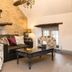 The Manor House Hotel in Dronfield lounge with stone wall, sofa, armchairs and coffee table