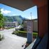 Park Hotel Abbadia in Abbadia Lariana with mountain views, roadside entrance and trees under blue sky