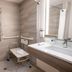 Holiday Inn Express & Suites Orange City - Deltona By IHG bathroom with walk-in shower and fold-down seat