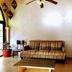 Mar de Cortez in Cabo San Lucas lobby with patterned sofa, coffee table, hanging lanterns and ceiling fan