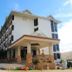 Ayara Grand Palace Hotel in Phitsanulok exterior with covered entrance and blue sky