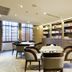 Centre Point Hotel Chidlom, Bangkok library lounge with seating and bookshelves