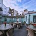 Hotel du Vin Brighton rooftop terrace with tables and wicker chairs in Brighton