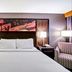 DoubleTree by Hilton Downtown Wilmington - Legal District guest room with king bed and bedside lamps