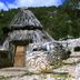 Turismo Rurale Belvedere Pradonos in Dorgali, rustic stone and wood lodge entrance with mountain backdrop