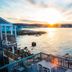 Bearskin Neck Motor Lodge in Rockport with oceanfront deck and sunset over the water