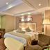 Zhong'an Huana Holiday Hotel in Hangzhou, a spacious guest room with king bed and seating area