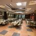 Silvercloud Hotel And Banquets Ahmedabad banquet hall with set dining tables and chairs
