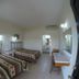 Mar de Cortez in Cabo San Lucas room with two twin beds, tiled floor, desk and wall mirror