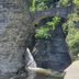 Hudson Manor Bed & Breakfast in Watkins Glen near a waterfall and stone arch bridge