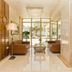 Santa Beach Hotel lobby in Agía Triáda with seating, glossy tile floor and large front windows