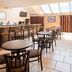 Best Western Resort Hotel & Conference Center Portage breakfast room with tables, bar seating and skylights