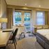 Parkhotel Tjaarda, Oranjewoud: hotel room with twin beds, seating area, and garden-view windows