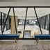 Delta Hotels by Marriott Ashland Downtown lobby mezzanine with angular glass railings and hanging globe lights in Ashland