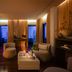 Worldhotel Cristoforo Colombo Milan lounge with warm lighting, seating area and city views