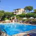 Résidence & Hôtel Aria Marina in Propriano with outdoor pool, loungers, and hillside views