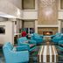 Residence Inn by Marriott Cleveland-Beachwood lobby lounge with turquoise chairs and a fireplace in Beachwood