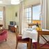 Apartamentos Vista Real in La Línea de la Concepción with a bright seating and dining area overlooking a balcony
