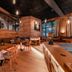 Sendlhofer's in Bad Hofgastein: cozy wood-paneled lounge with brick walls, tables, and a pool table