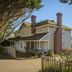 Mendocino Hotel and Garden Suites in Mendocino, hillside garden cottage with porch and ocean view